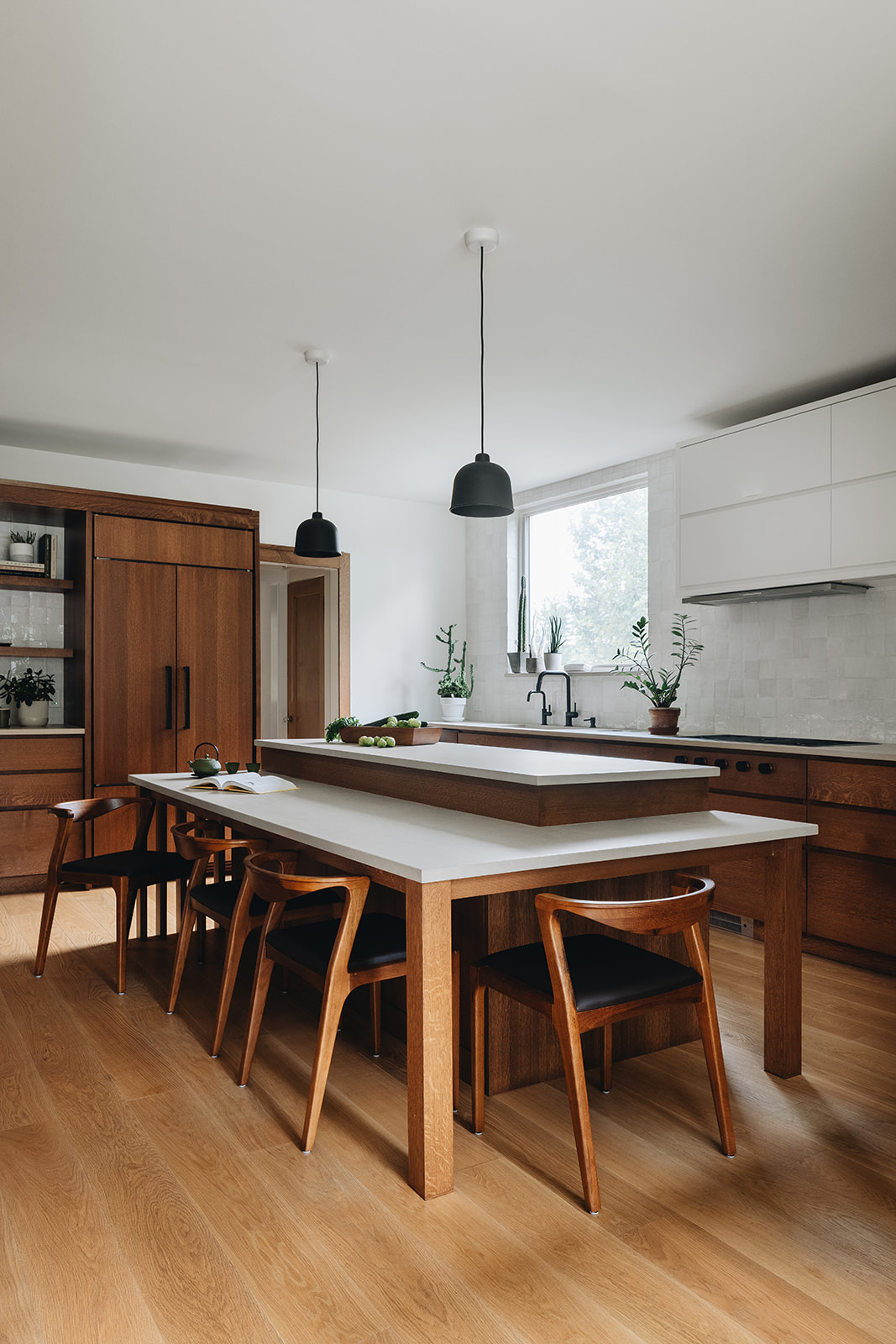 Large island with integrated table seating in modern kitchen