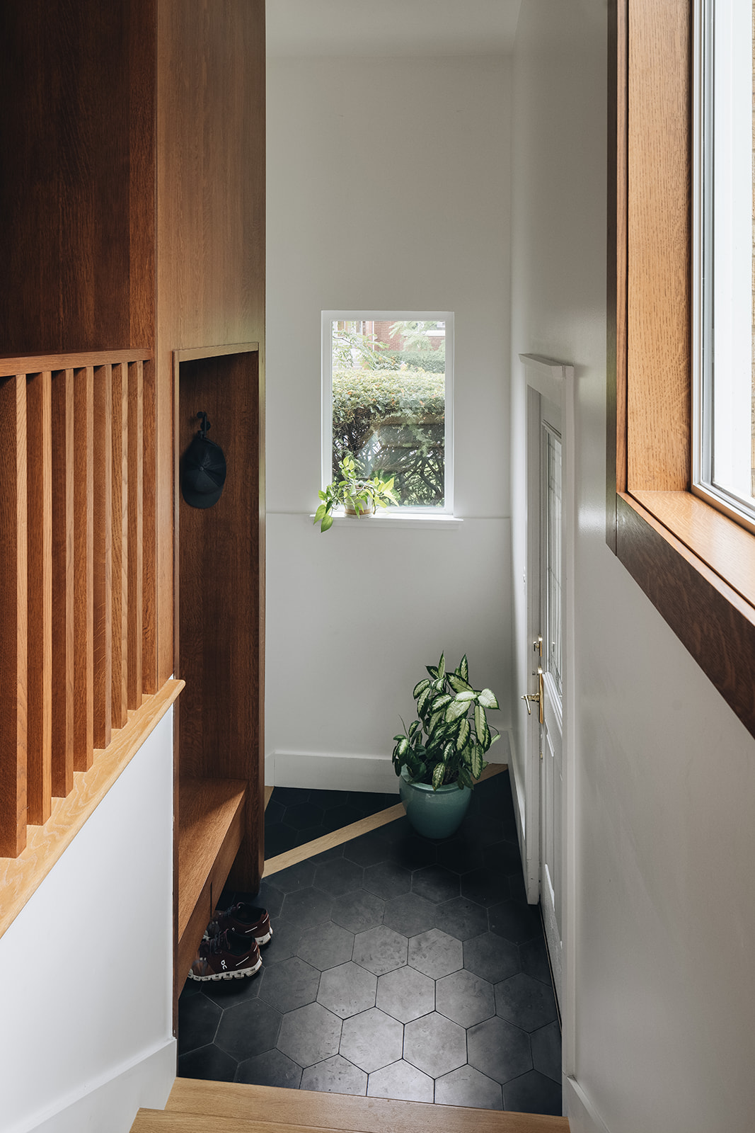 On-grade mudroom at the bottom of the new stair