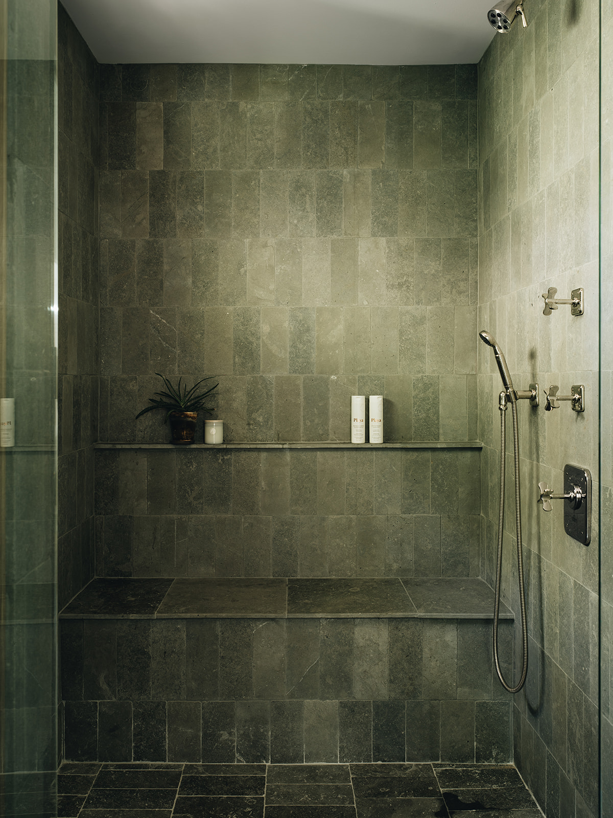 Standing shower with beautiful natural tiles