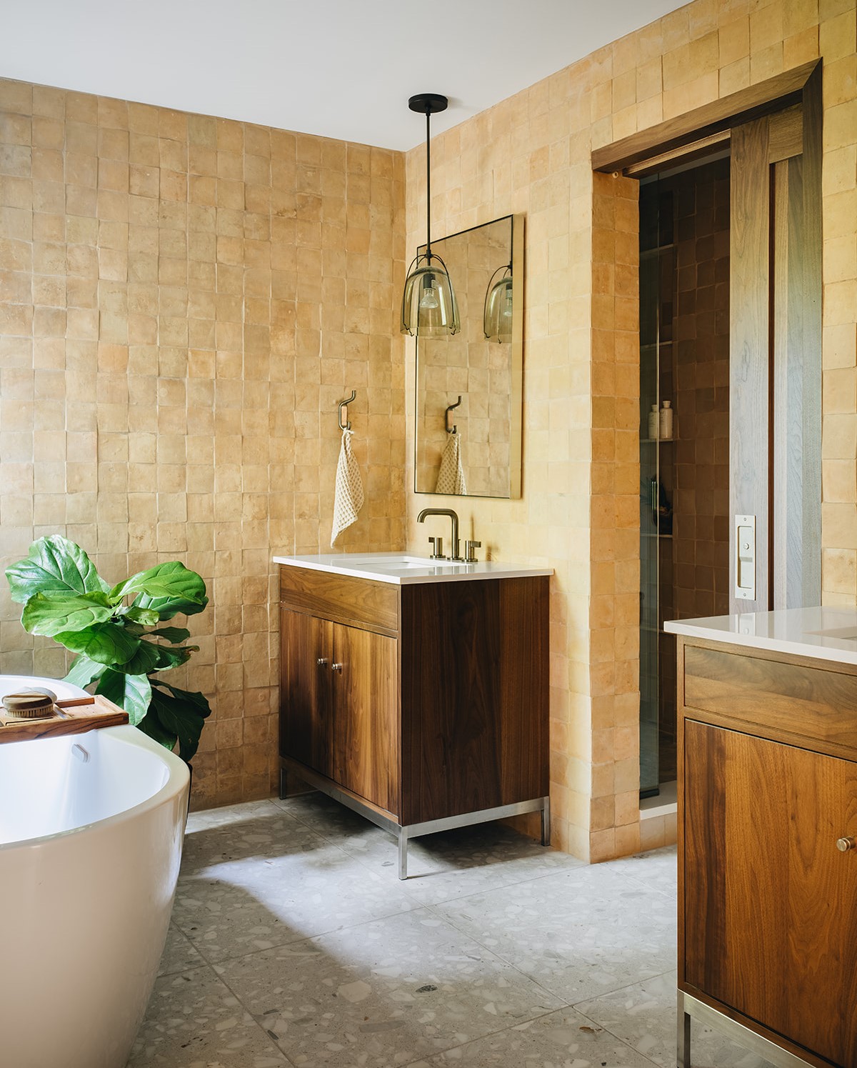 bathroom including two sinks and bathtub - tile walls and floors